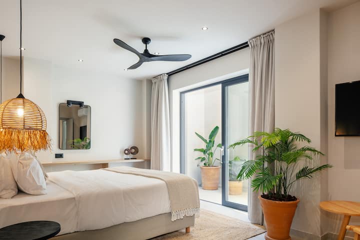 This room also features an ensuite bathroom, and a  43’’ TV,  and access to a staircase that leads up to the inviting pool terrace