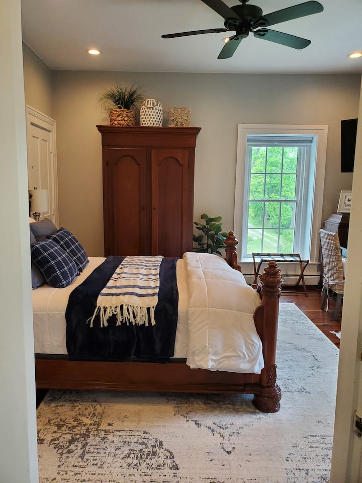 The morning greets you in Creekview Room. Includes a gorgeous Queen bed,  antique armoire closet along with your own  personal bathroom.