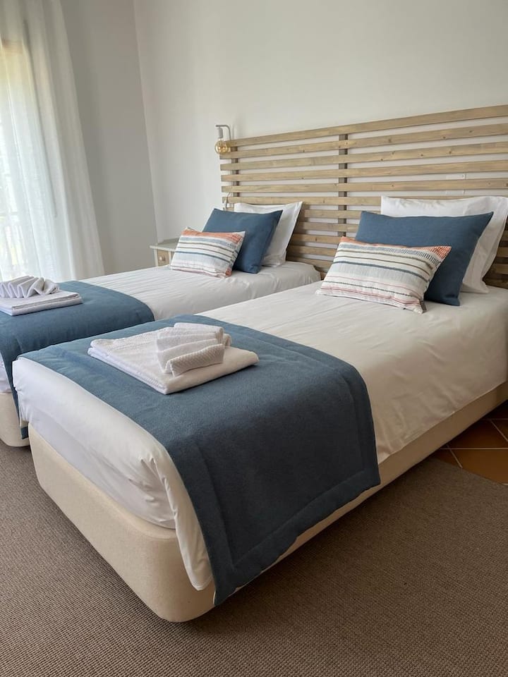 Two single beds or one double bed bedroom in the second floor with in-suite bathroom with shower