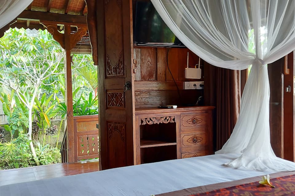 A carved wooden Joglo house in the Ubud rice fields, Ubud, Bali, Indonesia, photo 10 of 10