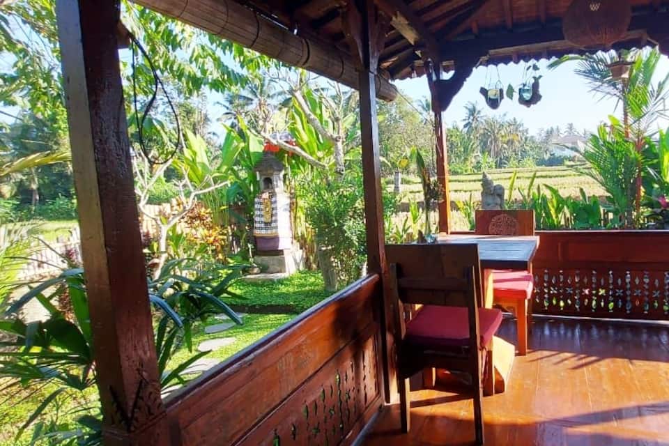 A carved wooden Joglo house in the Ubud rice fields, Ubud, Bali, Indonesia, photo 4 of 10