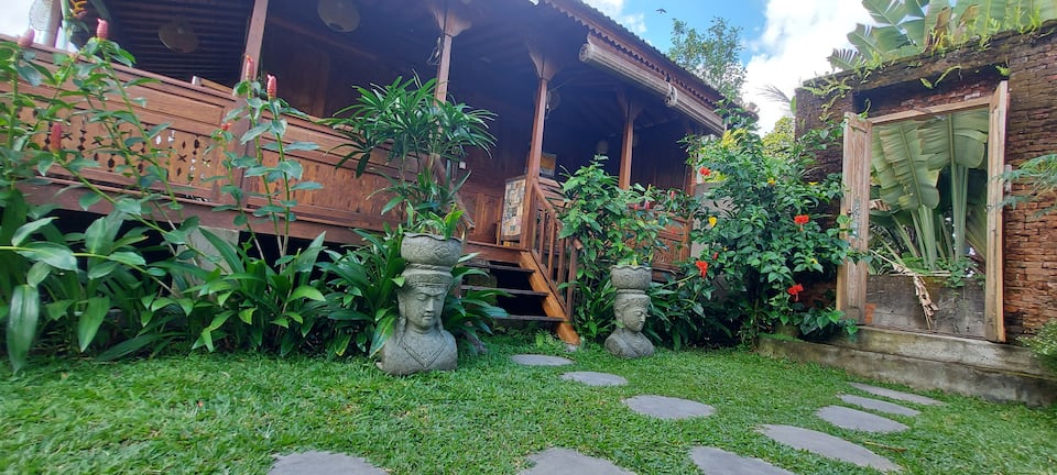 A carved wooden Joglo house in the Ubud rice fields, Ubud, Bali, Indonesia, photo 7 of 10