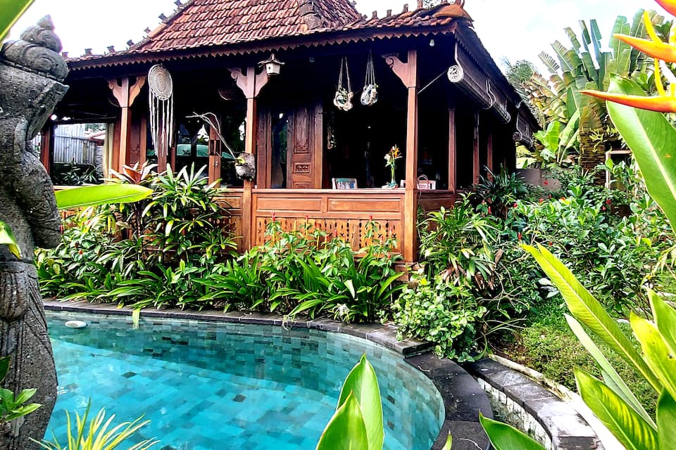 A carved wooden Joglo house in the Ubud rice fields, Ubud, Bali, Indonesia, photo 1 of 10
