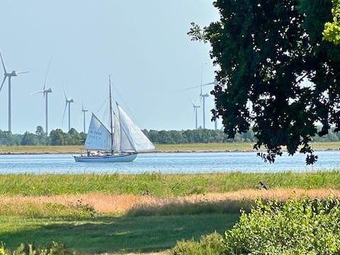 Summer house with water view in a quiet setting