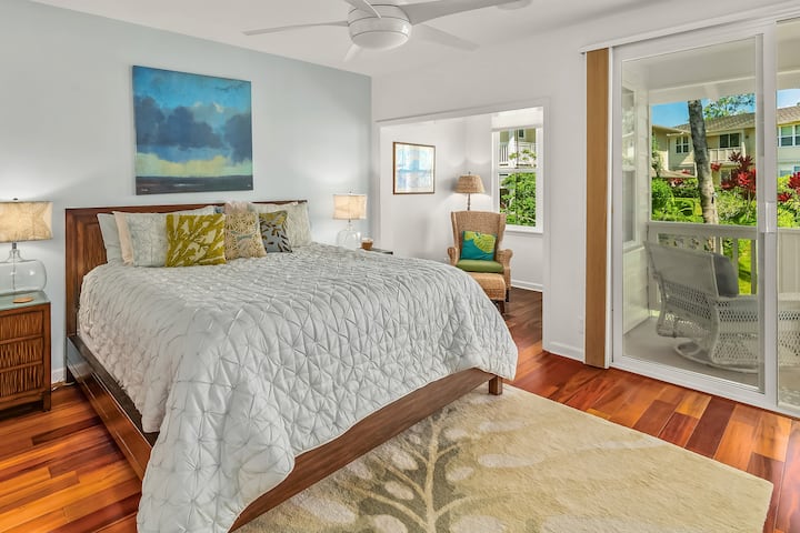 To the left of the top of stairs is the principle bedroom, private lanai, and bathroom.  This space features a king bed with high-end sheets, another alcove, a brand new tv (with cable!) and a new Dyson fan.  Notice the hardwoods continue throughout!