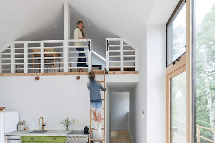 Up the ladder you will find the loft. We have arranged 2 full sized beds for additional sleeping arrangements. There is also a sofa, TV, games cupboard, and a desk for guests needing to do a little work :) 