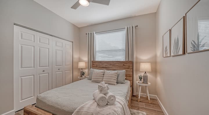 Guest Bedroom #2: Welcome to your serene bedroom featuring a cozy Queen bed, soothing ceiling fan, smart TV, ample storage, and room-darkening drapes. The perfect blend of relaxation and entertainment.