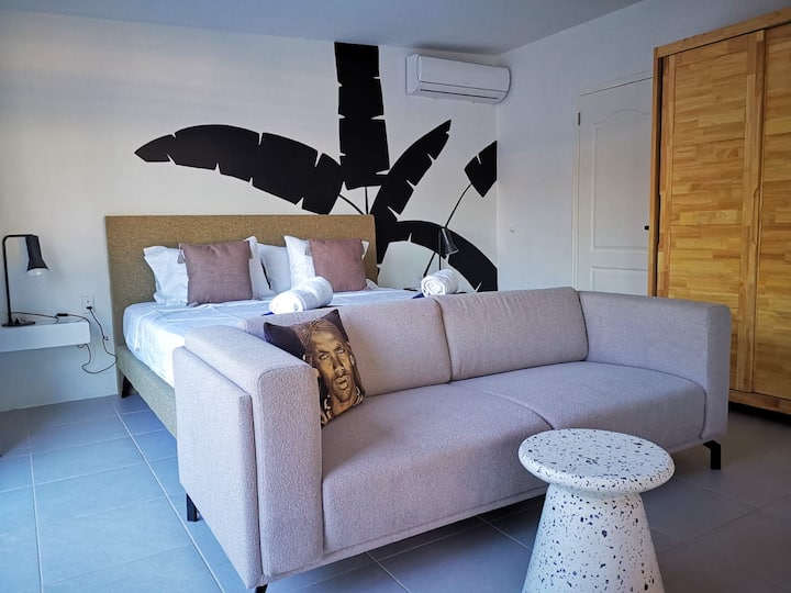 Master bedroom in house "TRES" with door to the bathroom. 