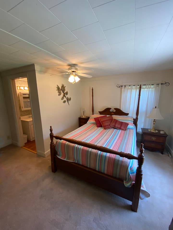 Upstairs queen bed with adjoining bathroom
