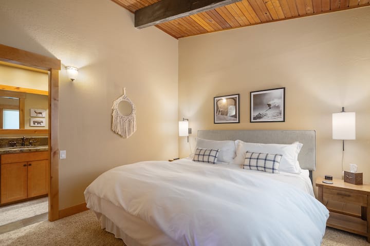 Upstairs master bedroom with king-size bed and on-suite full bathroom