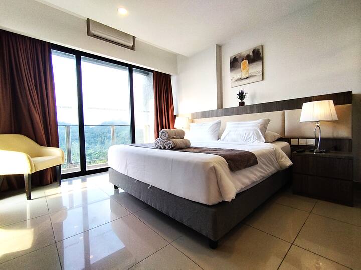 Ensuite Bedroom with 1 King Bed, Aircon, Wardrobe with Safe and Balcony with Mountain View.