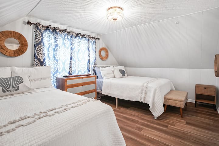 This stylish bedroom is furnished with 2 full sized beds. Plenty of room to get ready for what your day will bring!