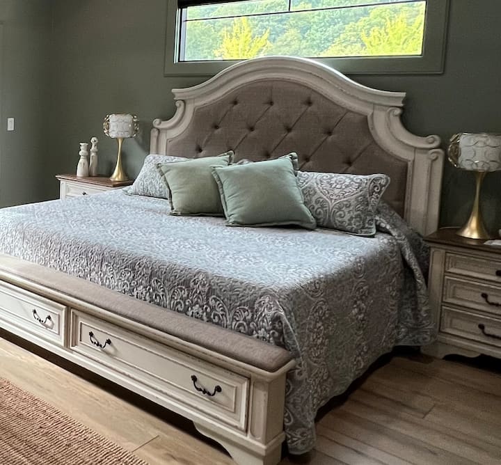 King size master bedroom. Storage drawers at the footboard, nightstands on each side with drawers, and a full size walk-in closet.