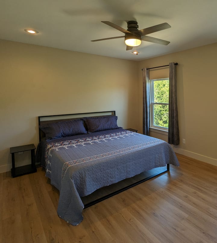 primary bedroom with king bed (split floor plan)