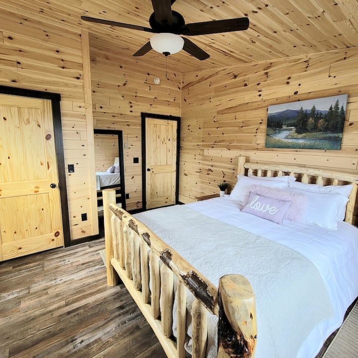 The cabin features pine tongue and grove walls and hand crafted bed frames, while you enjoy all the comforts of a home with central air and heat (even additional supplemental heat if you want one room warmer than the others).