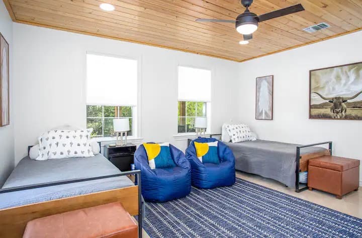 The 3rd bedroom has 4 twin beds.  2 are trundle beds.  A small TV is mounted on the wall for relaxing after a long day.