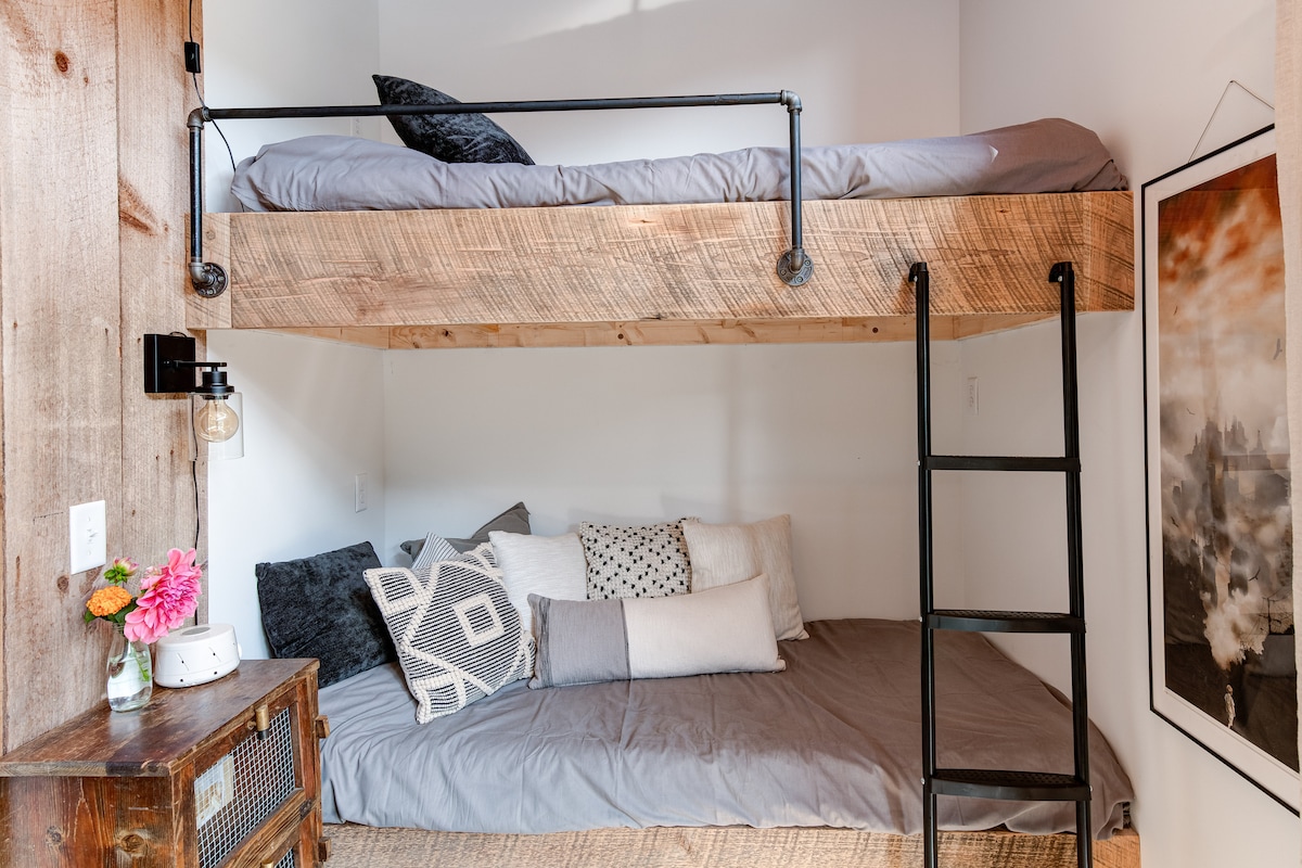 Custom-built bunks & they offer a truly unique view. The top looks directly out the original windows, giving you an amazing view of the mnts, animals & lavender. (Please note: This sleeping area is an open space, not a private room.)
