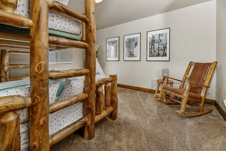 Discover fun and comfort in our downstairs bedroom, featuring cozy bunk beds perfect for families or groups. (NOTE - Rocking chair is gone and replaced with a dresser - not pictured)