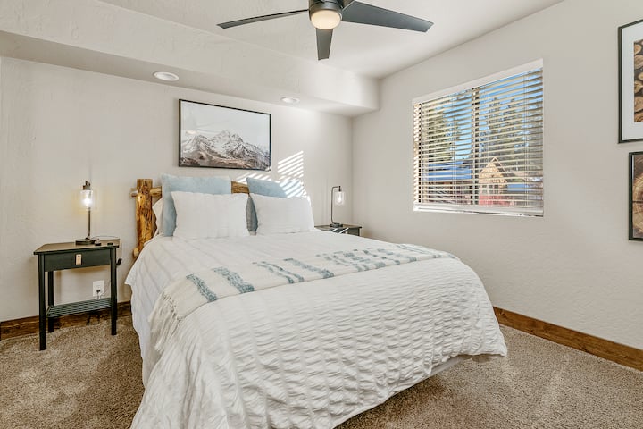 Retreat to our relaxing downstairs queen bedroom, designed for ultimate comfort and tranquility. This thoughtfully appointed space offers a restful escape with cozy furnishings and a serene atmosphere.