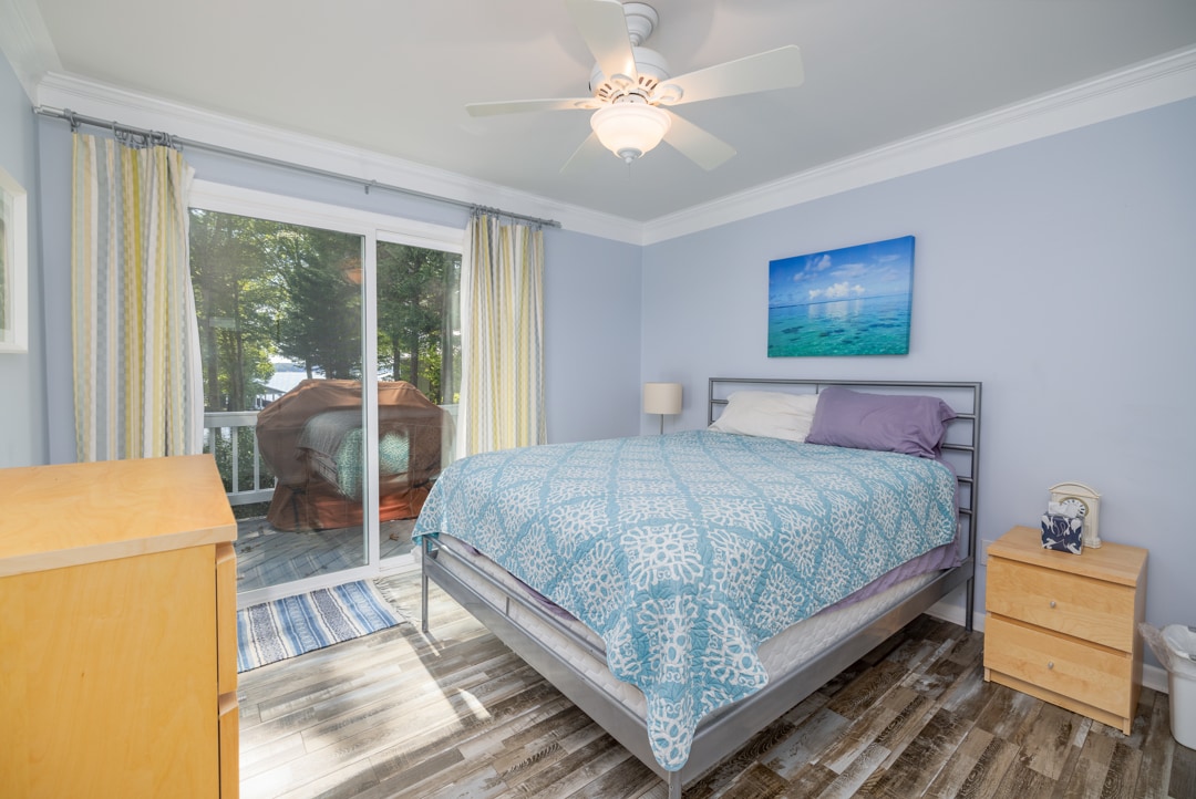 Queen, ceiling fan, dresser, closet, exit to deck

