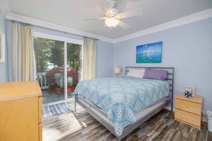 Queen, ceiling fan, dresser, closet, exit to deck

