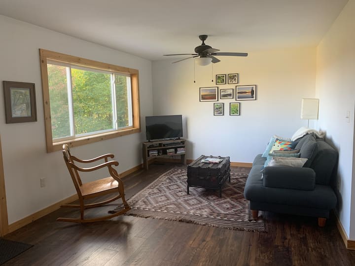 Living room for lounging, movies, and taking in the mountain view.