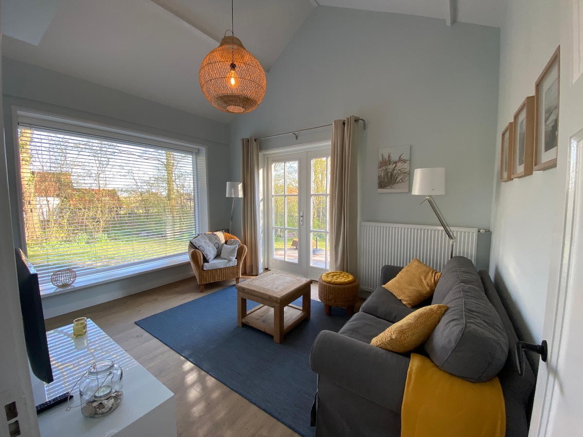 Popular Airbnb listing: Vacation home Duinhoek, in the forest by the sea in Dishoek