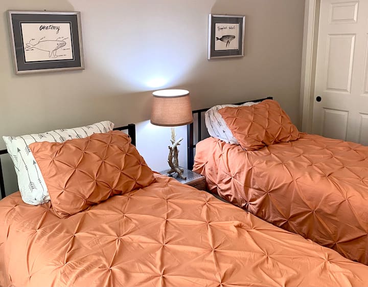 Our twin bedroom features two twin xl beds with additional trundle beds beneath. Blackout shades help encourage a long restful sleep even during bright summer evenings. 