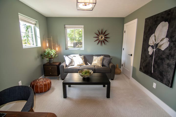 The downstairs bedroom is dual-purpose. We leave it set up in this configuration by default allowing you to utilize the couch as part of the office or game room. If you prefer, there is a pull-out Queen bed with mattress topper.