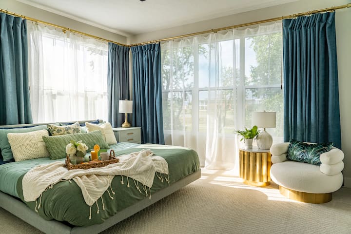 We absolutely love how this bedroom turned out! Big, beautiful third-story windows let in beautiful colors from the sunset  and allow you watch the sunrise from bed if you choose (or pull the drapes if you feel like sleeping in).
