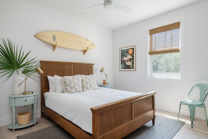2nd Floor Private Queen Guest Room- Original surfboard art, pull-down bamboo shades and ceiling fan on remote. 