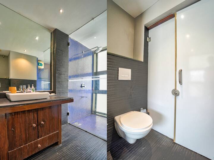 Modern Bathroom with geyser for hot & cold water plus shower cubicle.
