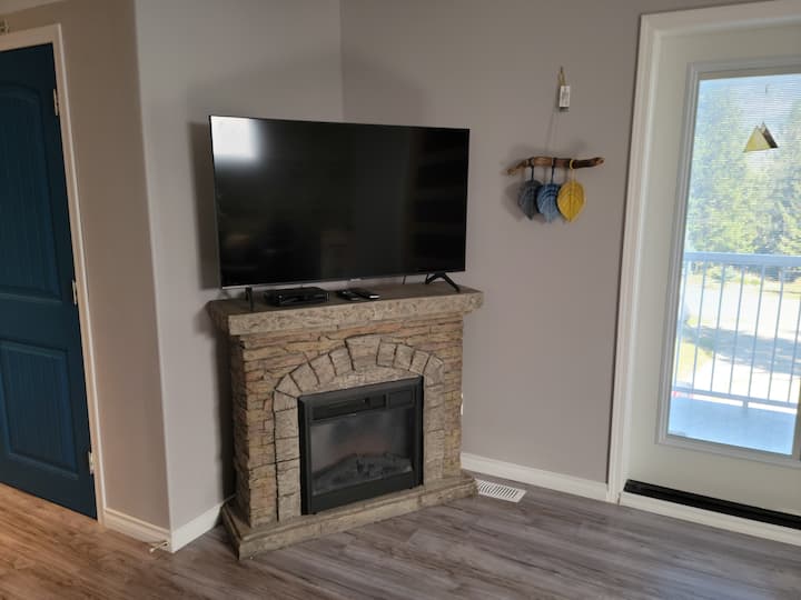 TV with Telus package, Netflix, Crave and Prime for your enjoyment...electric fireplace provides some ambiance...