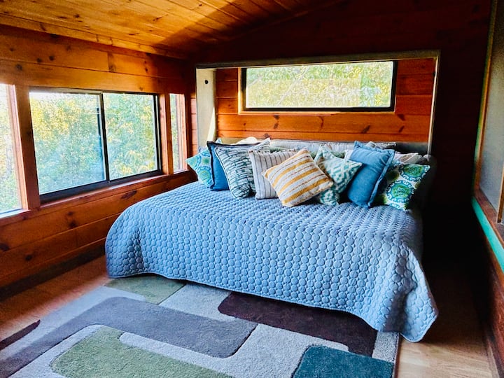 The sunroom has tons of east-facing windows and has a queen size murphy bed that doubles as a day bed. This space can be used as an extra sleeping area, great for kids. 