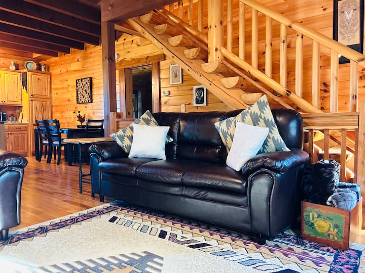 The second couch in the living room is accompanied with plush blankets making this a perfect area to get cozy and watch movies or play games. 