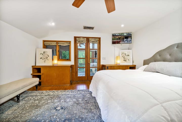 Interesting fact about the main bedroom:  The two built-ins in the back of this picture are actually headboards for twin beds.  In the time that this home was built, couples often slept in separate beds.  Each headboard is built around a heater.