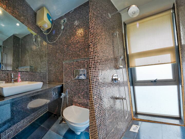 Modern Bathroom with geyser for hot & cold water.