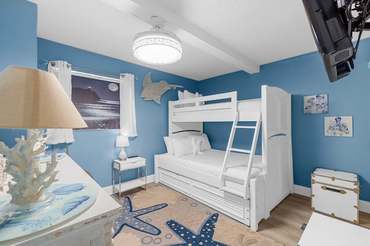 Second bedroom includes a twin over full-sized bunk bed plus a twin trundle bed! Also offers dresser and closet space plus its own TV. 