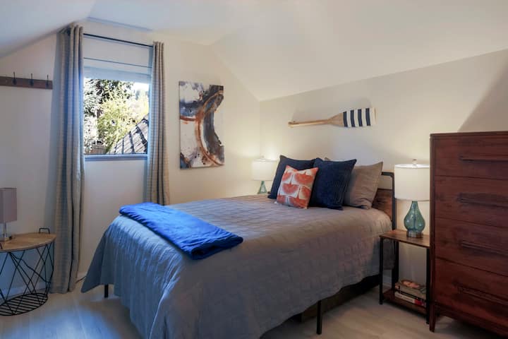 The White Crane bedroom provides a getaway space upstairs that is quiet and serene. The bedroom features a queen-sized bed for up to 2 adults.