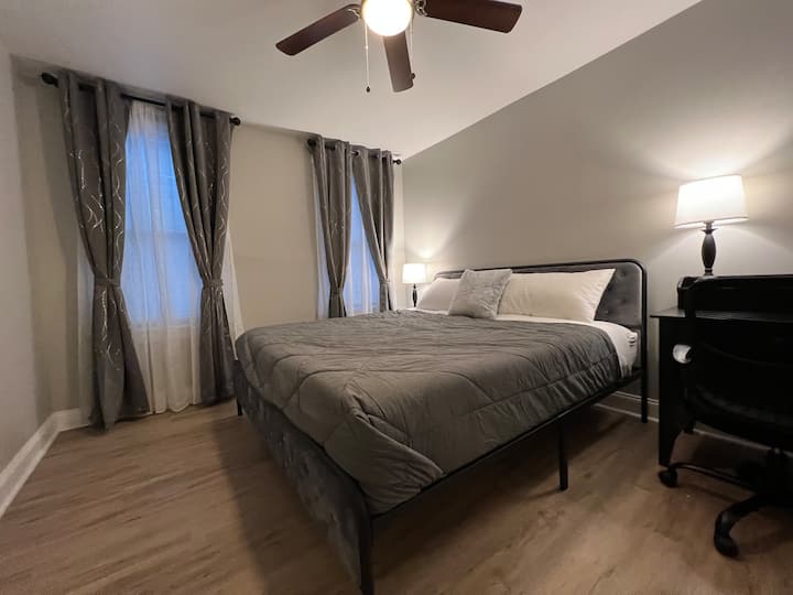 Room 3 bedroom with a king bed and two windows