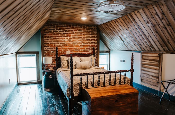 Upstairs Bedroom complete with Queen size beds with memory foam mattress, ceiling fan/light, nightstands, smart TV's with streaming channels, charging plugs for phones, luggage racks, dresser, and rocker.  Plenty of room for 2!