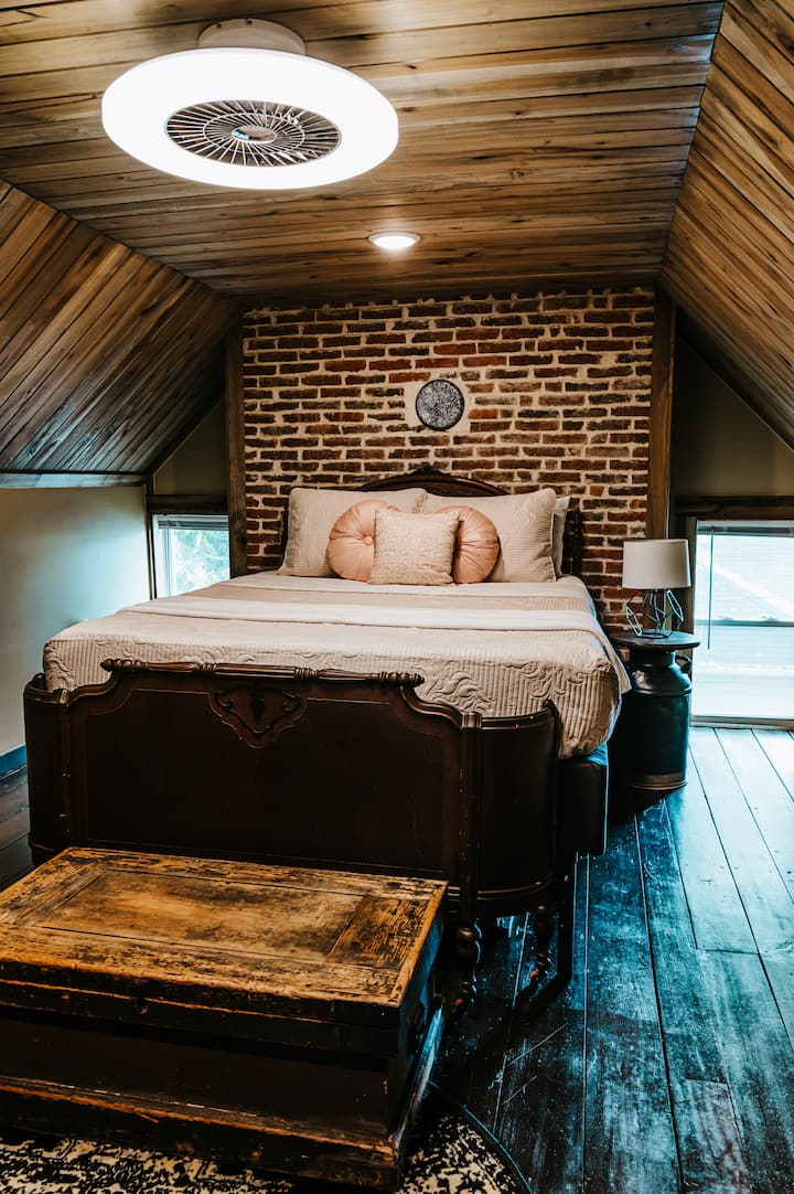 Upstairs 2nd Bedroom includes a Queen size memory foam mattress, smart TV w/streaming, a rocker, ceiling fan/light combo, and small dresser.  Luggage rack available and 2 nightstands with USB charging ports at outlet for modern day conveniences.