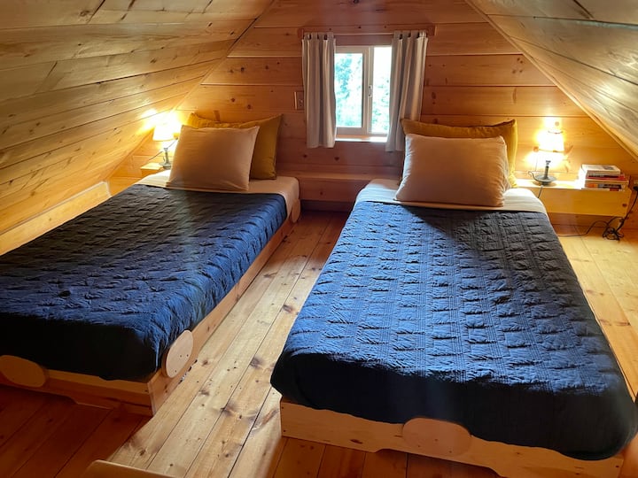 Two twin beds. Push them together if you like to make one big bed. Quality bedding of linen and cotton, extra pillows, and memory foam mattresses will let you sleep comfortably.