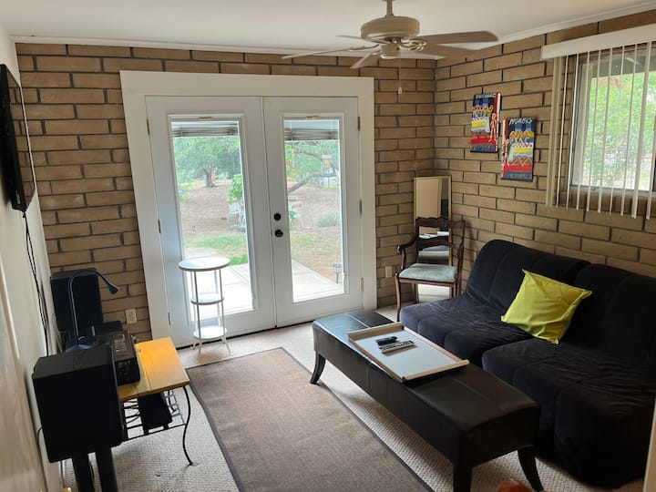 The TV/sunroom and 2 twin futon beds (king size put together).  Gorgeous view of the backyard.
