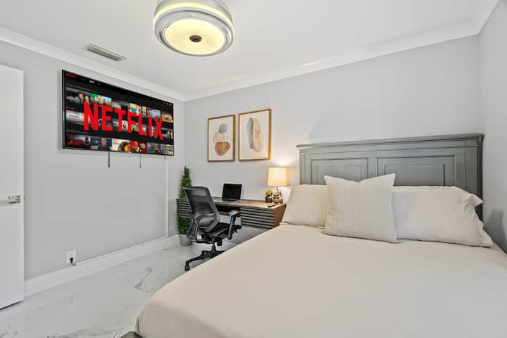 Guest room #2 features a full sized memory foam mattress, a private work space with floating desk & desk chair. Theres also a mounted smart TV and incudes a full length mirror and closet storage with shelving and racks. 