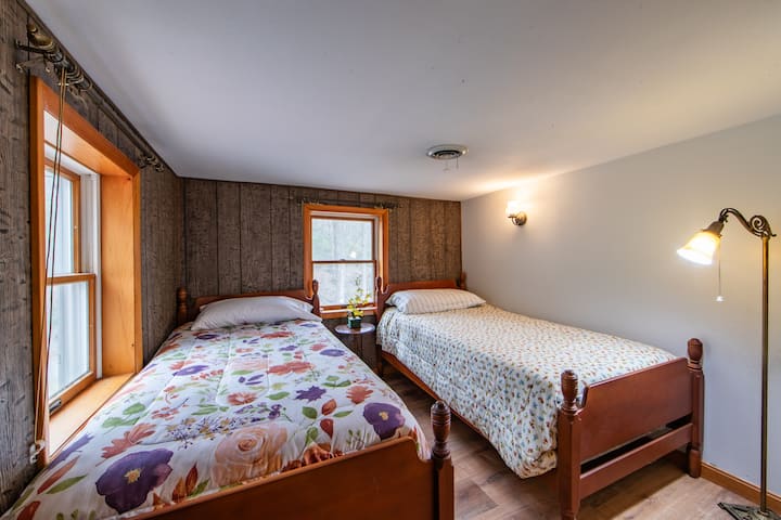 Secondary bedroom with 2 twin beds and shared full bathroom (on 2nd floor). NOTE: There is only 1 access point to this bedroom through the shared hallway bathroom.