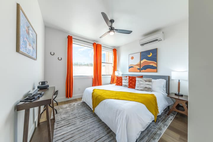 2nd bedroom, located downstairs, sleeps 2. One king size bed. 