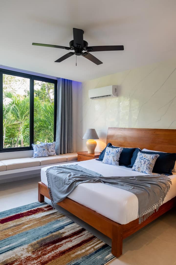 Room 4 beckons with a spacious king-sized bed and a private full bathroom. 
