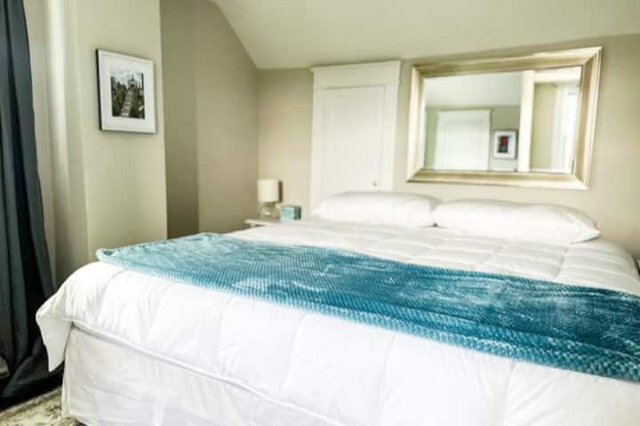 Bedroom at the left at the top of the stairs.  Featuring a King Bed.