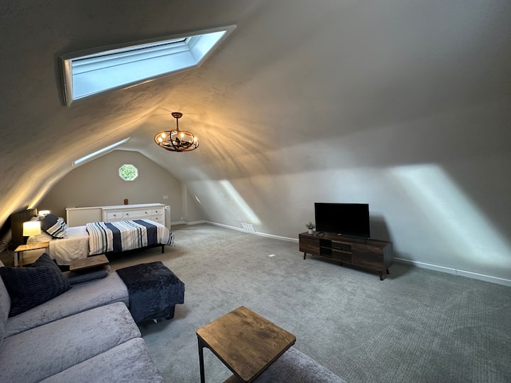 Private lofted area with queen bed, large couch and 43 in smart TV (Roku). 